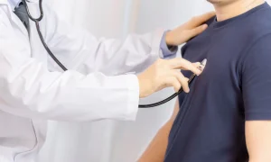 doctor-examination-young-man-with-stethoscope-hospital_1150-12971
